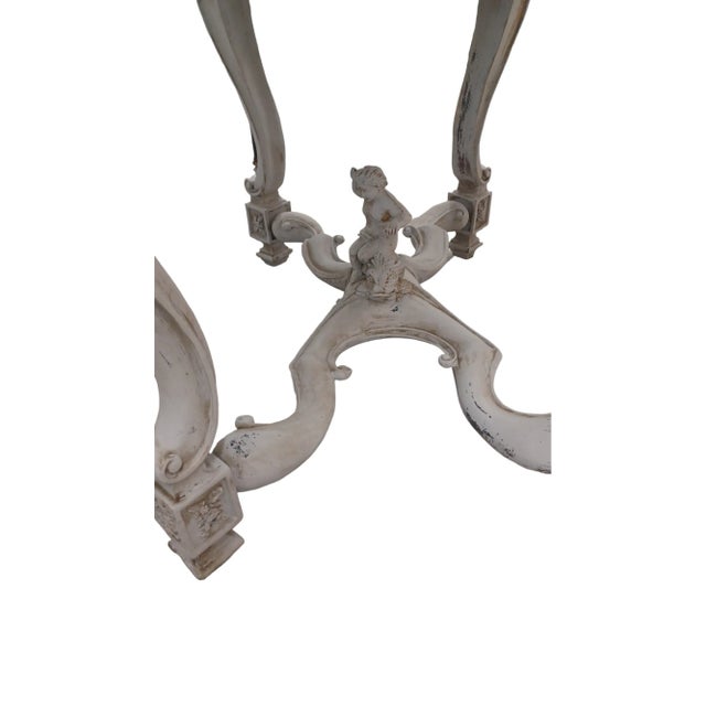 Antique Italian Pietra Dura table Circa 1880s. Marble top depicts a bird with floral designs. The base is wooden with...