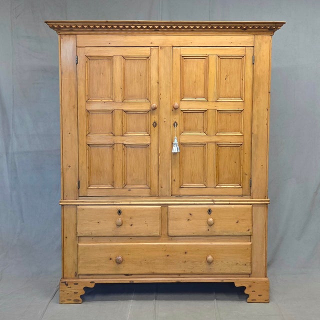 A beautiful and functional antique late 1800s hand crafted scrubbed pine Irish linen press cabinet. The distinctive window...