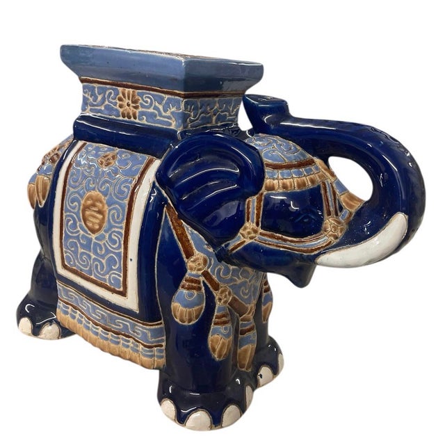 A Regency-inspired whimsy and global flair could be added to your interior by this striking ceramic elephant side table....