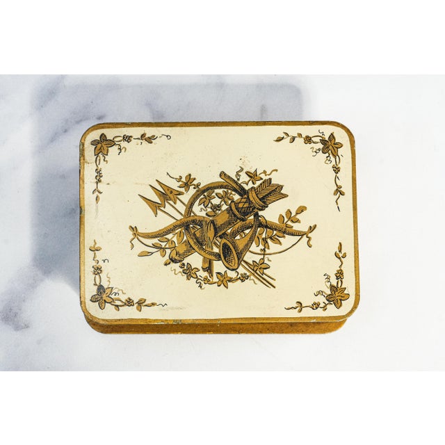 A beautifully refined example of French decorative artistry, this pressed metal trinket box embodies a timeless...