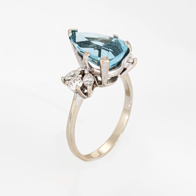 Stylish aquamarine & diamond cocktail ring crafted in 14k white gold (circa 1980s). Faceted pear cut aquamarine measures...