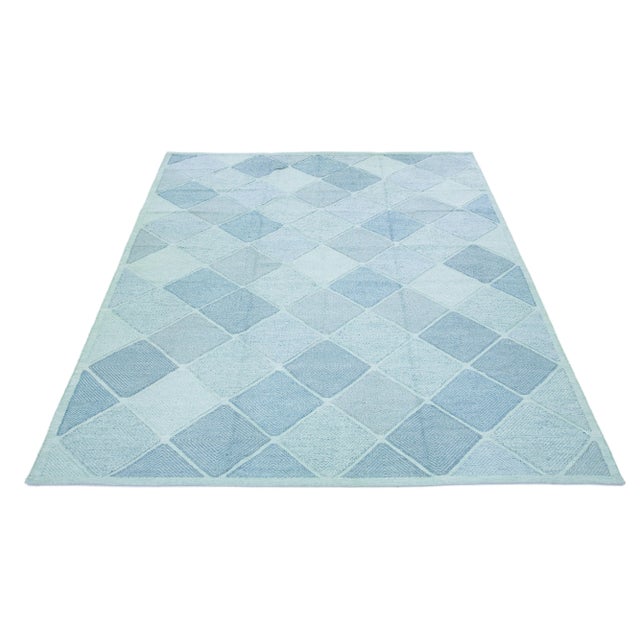 Beautiful modern Swedish-style wool rug with a Turquoise-blue field. This Swedish rug has a gorgeous all-over geometric...