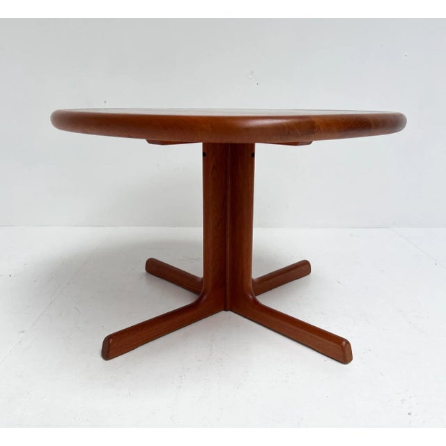 Square, yet with organically shaped corners, this side or coffee table by Dyrlund dates from the 1960s. The tabletop rests...