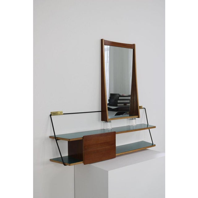 This Italian set, consisting of a mirror and a console, dates from the 1950s and was designed by Eugenia Alberti Reggio....