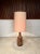 This high-quality table light features a very large vase-shaped base of glazed ceramic. The lamp has the original lamp...
