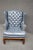 Leathercraft wingback chair in blue tufted leather with brass nailhead trim and mahogany frame.