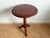 This vintage mahogany tripod table features a charming circular top resting upon an intricately designed barley twist...