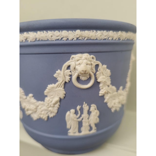 This exceptional matching pair of mid-century cachepots (planters) was crafted in England by the world-renowned Wedgewood...