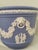 This exceptional matching pair of mid-century cachepots (planters) was crafted in England by the world-renowned Wedgewood...