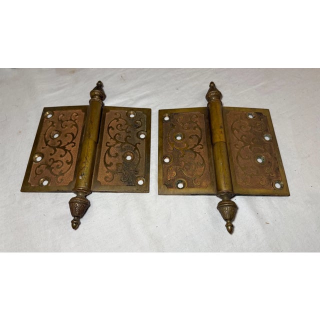 Up for sale is an exquisite high quality pair of antique 19th century ornate solid brass door hinges. These hinges are...