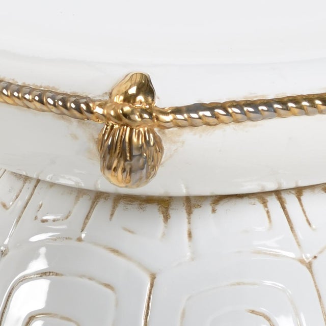 Antique white glazed ceramic with metallic gold details