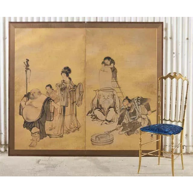 Whimsical Japanese late Edo period two-panel screen circa 1800 by Yokoyama Kazan (Japanese 1784-1837). The screen depicts...