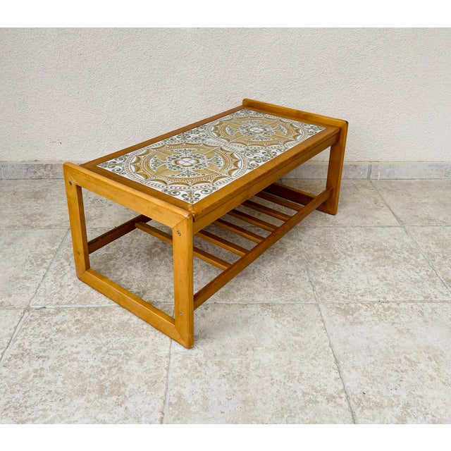 Stunning vintage coffee table with a Scandinavian design, typical of the 1960s/70s. The base and frame are made of solid...