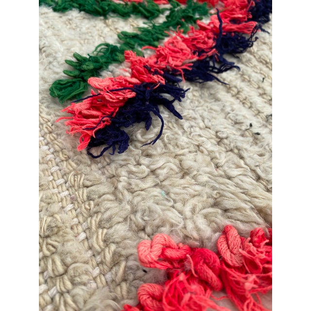 Hand-woven by the Berber women in the Atlas Mountains, this rug is created with soft natural wool fibers from the tribe’s...