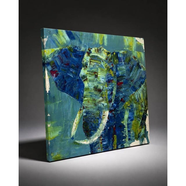 Vibrant abstract oil painting on square canvas featuring an elephant rendered with thick, textured brushstrokes. The...