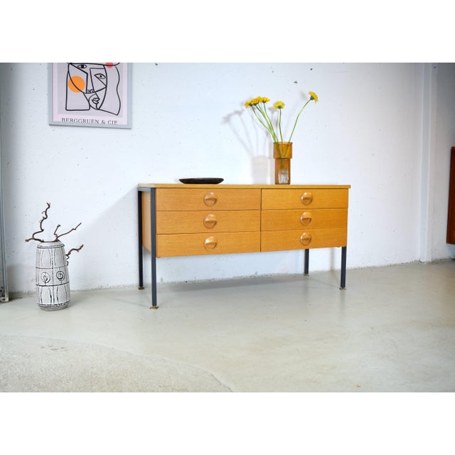This is an iconic mid-century sideboard from Deutsche Werkstätten Hellerau, designed by Joachim Nebelung. The sideboard is...