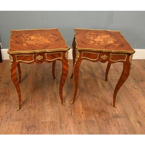 A superb pair of french louis xv style marquetry and ormolu mounted side tables, crafted in richly figured kingwood and...