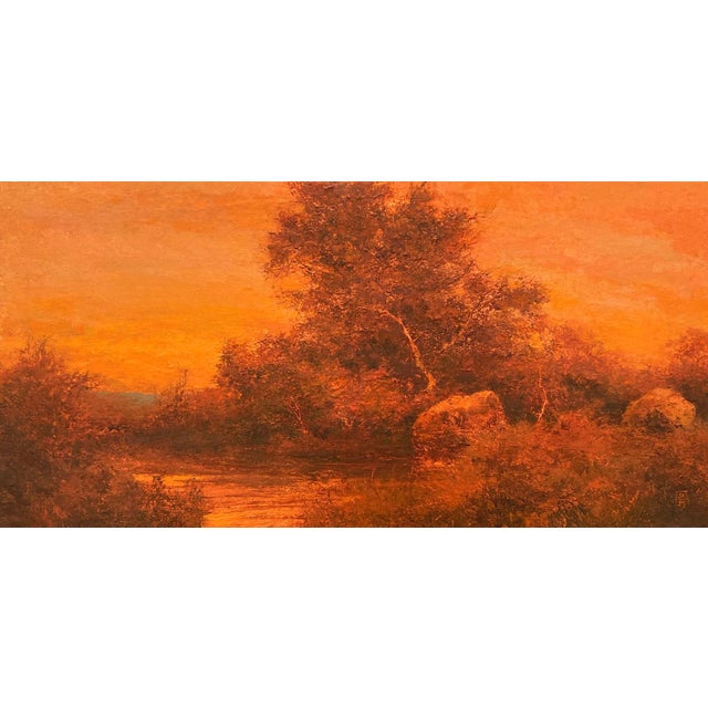 This oil painting on linen panel captures a serene landscape bathed in warm, amber hues, evoking a sense of tranquility...