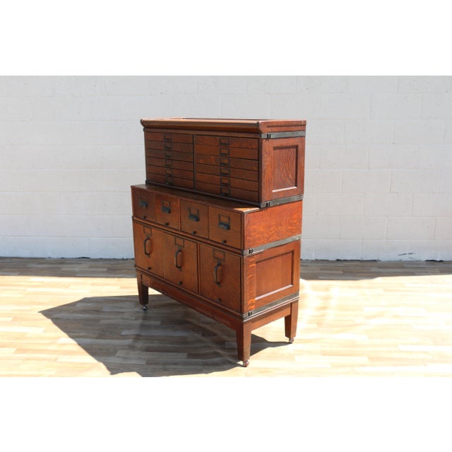 Beautiful antique Arts & Crafts modular stacking file cabinet dating to the early 1900s, crafted from richly figured tiger...