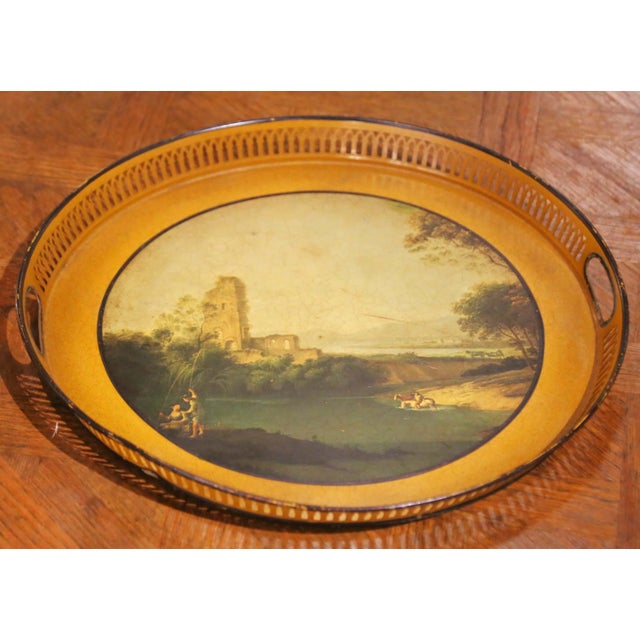 Decorate a coffee table, ottoman, or bar with this elegant antique painted tray from France, crafted circa 1870. The...