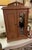 The Antique Miniature armoire is a charming and intricate piece of furniture that is perfect for collectors of antiques....