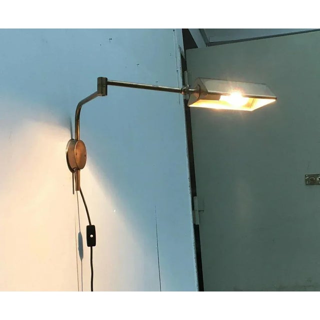 Elegant wall lamp from shining designer Florian Schulz. The design impresses with its simple elegance and the high...