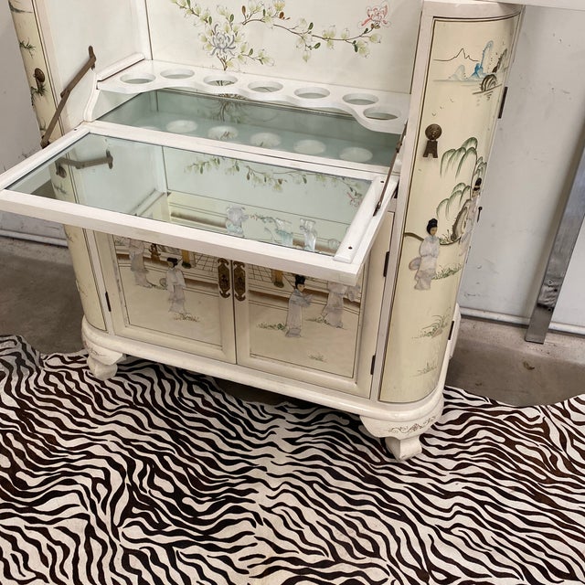 Absolutely breathtaking rare Chinoiserie bar in white. Certain to be the attention of any room with it's stunning hand...
