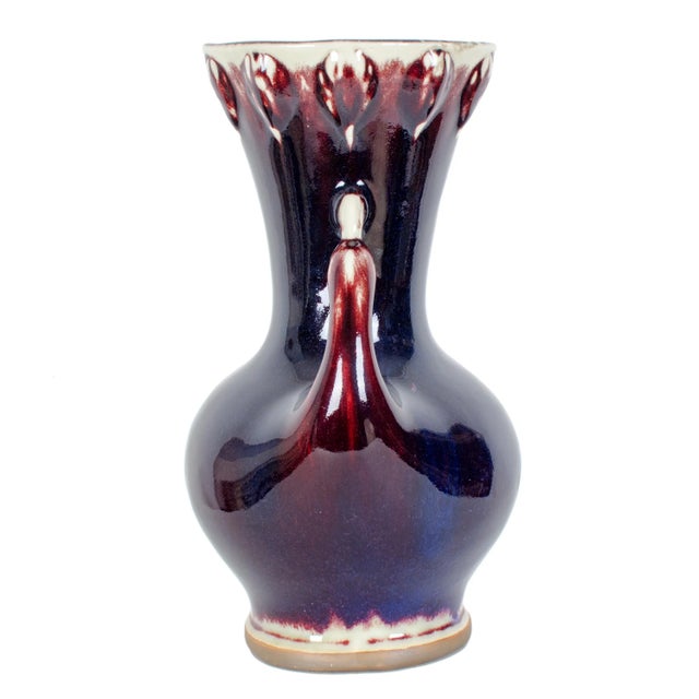 Vintage sang de boeuf baluster vase with bird form handles covered largely in deep blues and oxblood. Excellent condition....
