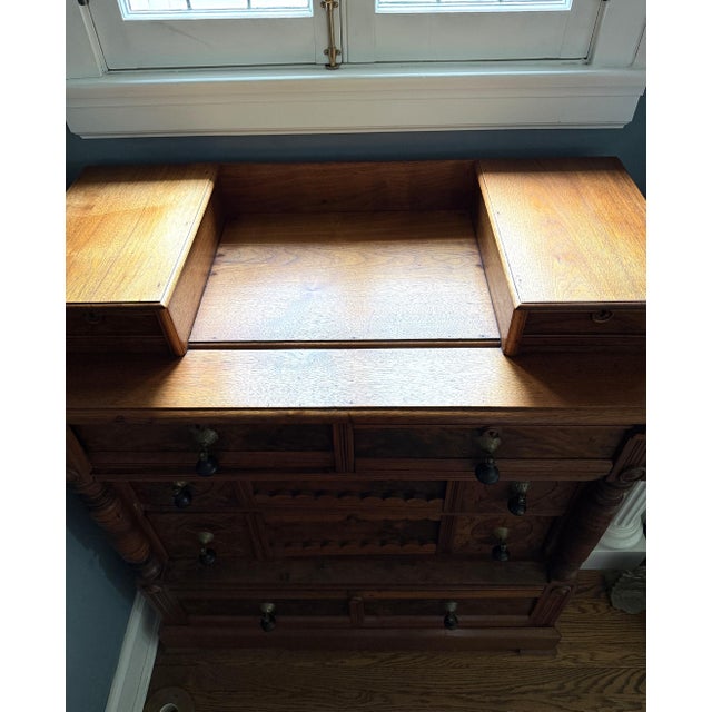 Here is a quality walnut dresser in the Victorian Eastlake style with teardrop wood and brass drawer pulls. This is an AI...