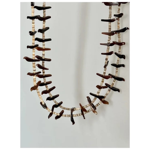 Double strand Zuni fetish necklace with heishi beads and birds. Some of the birds have inlaid white eyes. Wonderful piece...