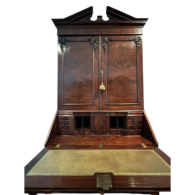 This remarkable George III secretary in burled walnut from the late 18th century is a true work of art. Standing at 96.25”...