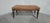Very nice mahogany Regency-style stool, standing on reeded legs with brass cup castors, bergère top with a brown leather...