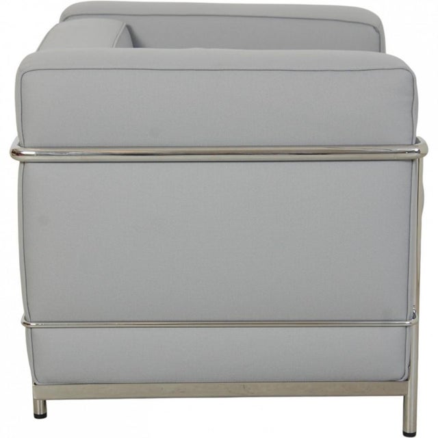 Le Corbusier LC2 chair upholstered in grey-blue fabric and with a chrome frame. The chair is from the 2010s and appears in...