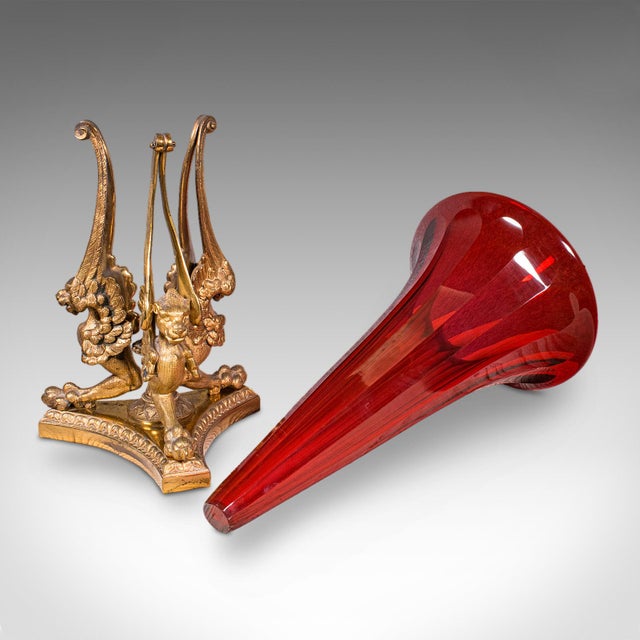 This is an antique epergne. A French, gilt bronze and art glass flower vase, dating to the early 20th century, circa 1920....