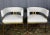 Pair of armchairs by Artistic Frame. Polished brass frames and leather upholstery on these Jamie model armchairs. These...