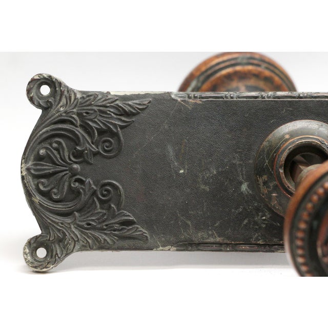 The bronze Italian Renaissance style two fold knob was made by Corbin in the 1895 catalog. It is part of the F-21300...
