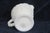 This adorable Creamer / Small Pitcher is made of milk glass. This darling piece features a classic vintage silhouette with...