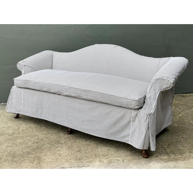 This vintage Hickory Chair camelback sofa embodies the brand's enduring reputation for traditional design and quality...