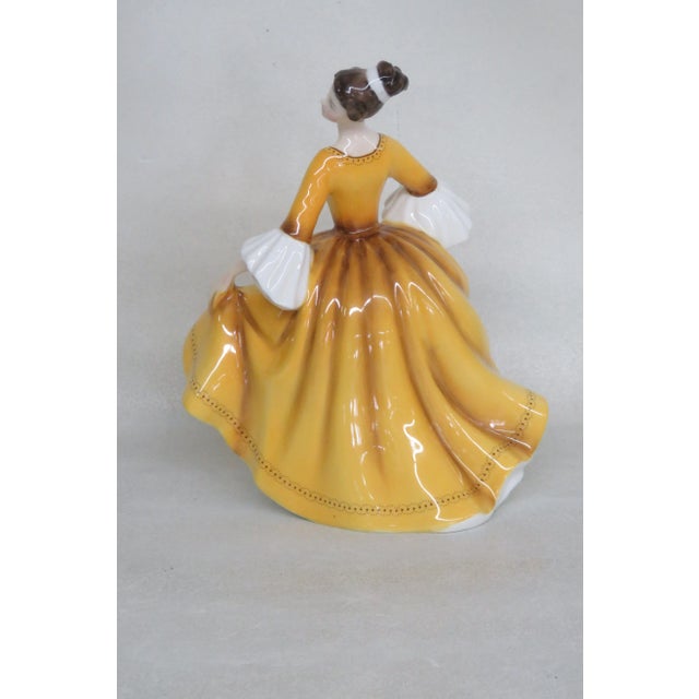 This gorgeous figurine is made of bone china / porcelain. This lovely collectible is stamped as having been made in...