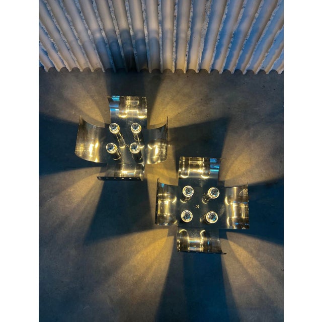 Striking and sculptural, this rare pair of chrome table lamps by Italian designer Goffredo Reggiani showcases the bold,...