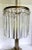 Here is a sophisticated and elegant table lamp from the early mid-century. The lamp features a two-tier marble and brass...