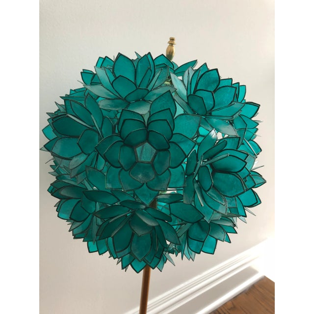 Beautiful capiz shell translucent shade shaped like a flower on a gold leaf iron base. Clear cord with switch Accommodates...