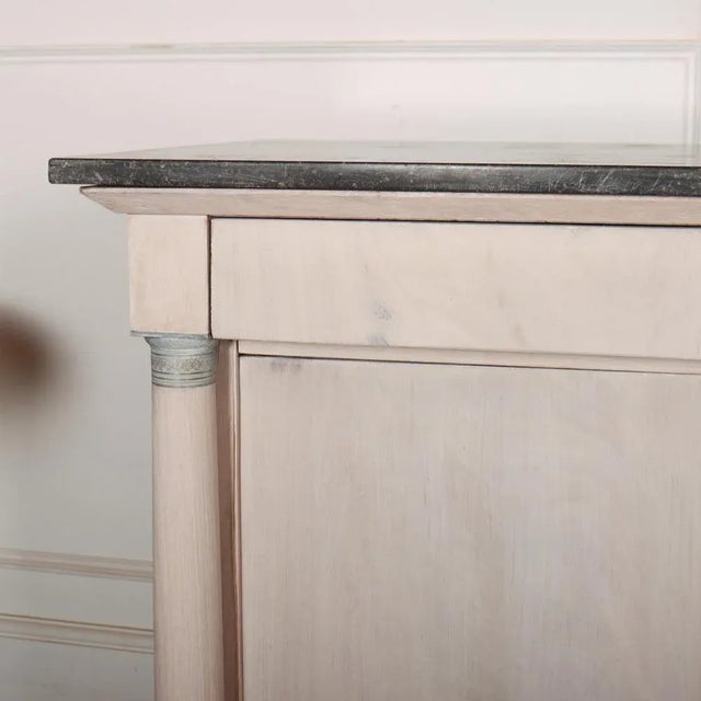 Early 20th Century French Empire style bleached walnut enfilade with a marble top. 1920 This piece is designed in the...