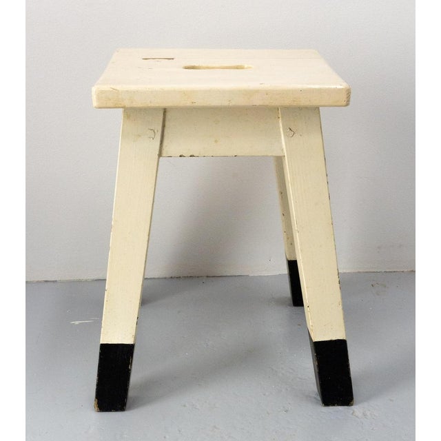 Painted stool made circa 1950 French. Thanks to its small height: 16.14 in. (41 cm), it is ideal to be used as a footboard...