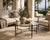 A substantial Michael Taylor Designs “Montecito” round cocktail or coffee table, circa 2000s, combining the relaxed...