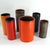 A set of tube-shaped/cylinder vases made of ceramic. They are finished inside and out with glazes in various colors. They...