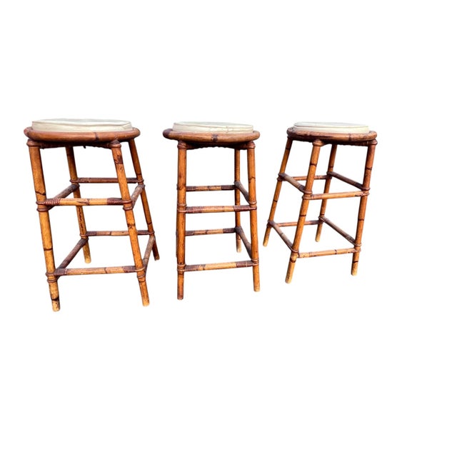 Set of 3 Vintage Bamboo & Rattan Bar Stools Bring relaxed coastal charm and organic texture to your space with this set of...