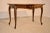 19th century French pine side table with a shaped top which has a bevelled edge, following down to a scalloped apron,...
