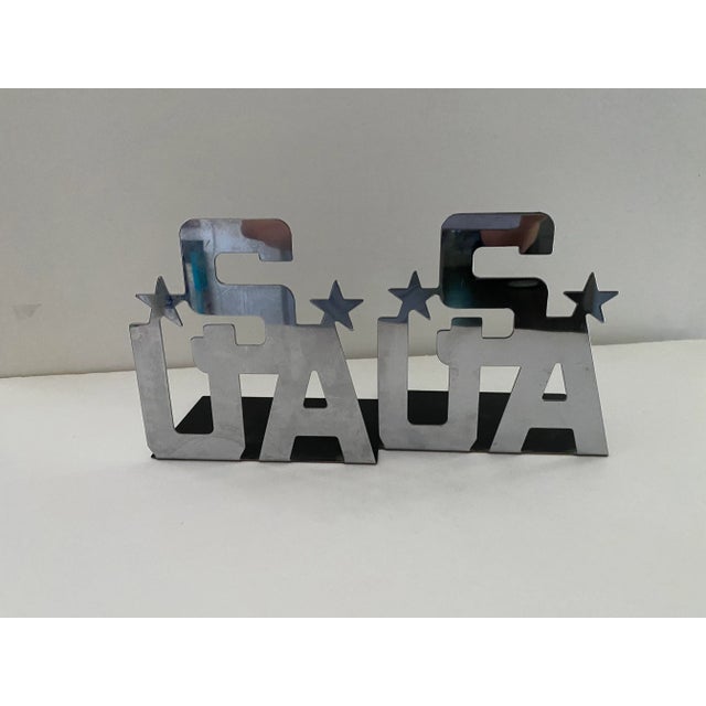 These are Mirrored Chrome finish bookends. USA with star. Protective seal in interior is still intact. I purchased from...