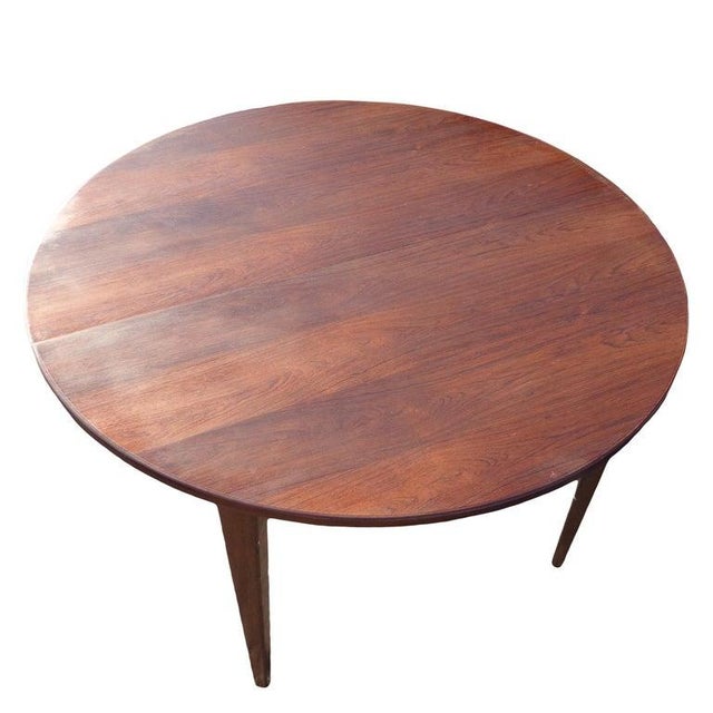 Danish rosewood round dining table Attributed to Hans Olsen this round table measures 47.25? in diameter and has a rich...